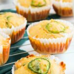 corn muffins with sliced jalapeno on top.