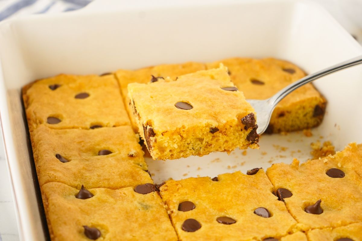 serving chocolate chip bar cookies on spatula.