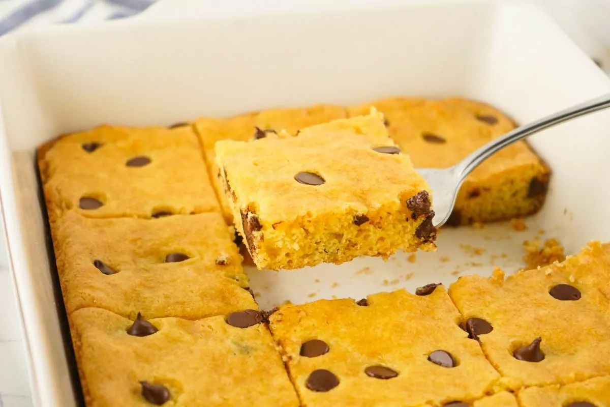 serving chocolate chip bar cookies on spatula.