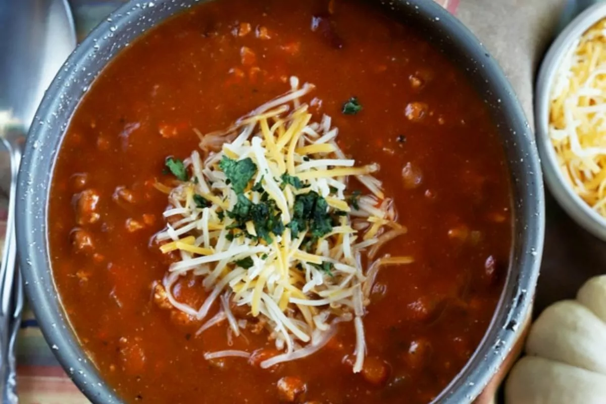 a bowl of Pumpkin Turkey Chili with cheese at the top