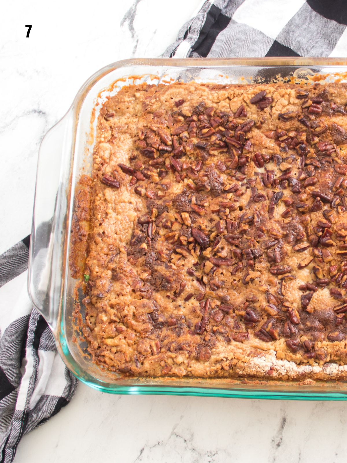 baked pumpkin dump cake in glass baking dish.