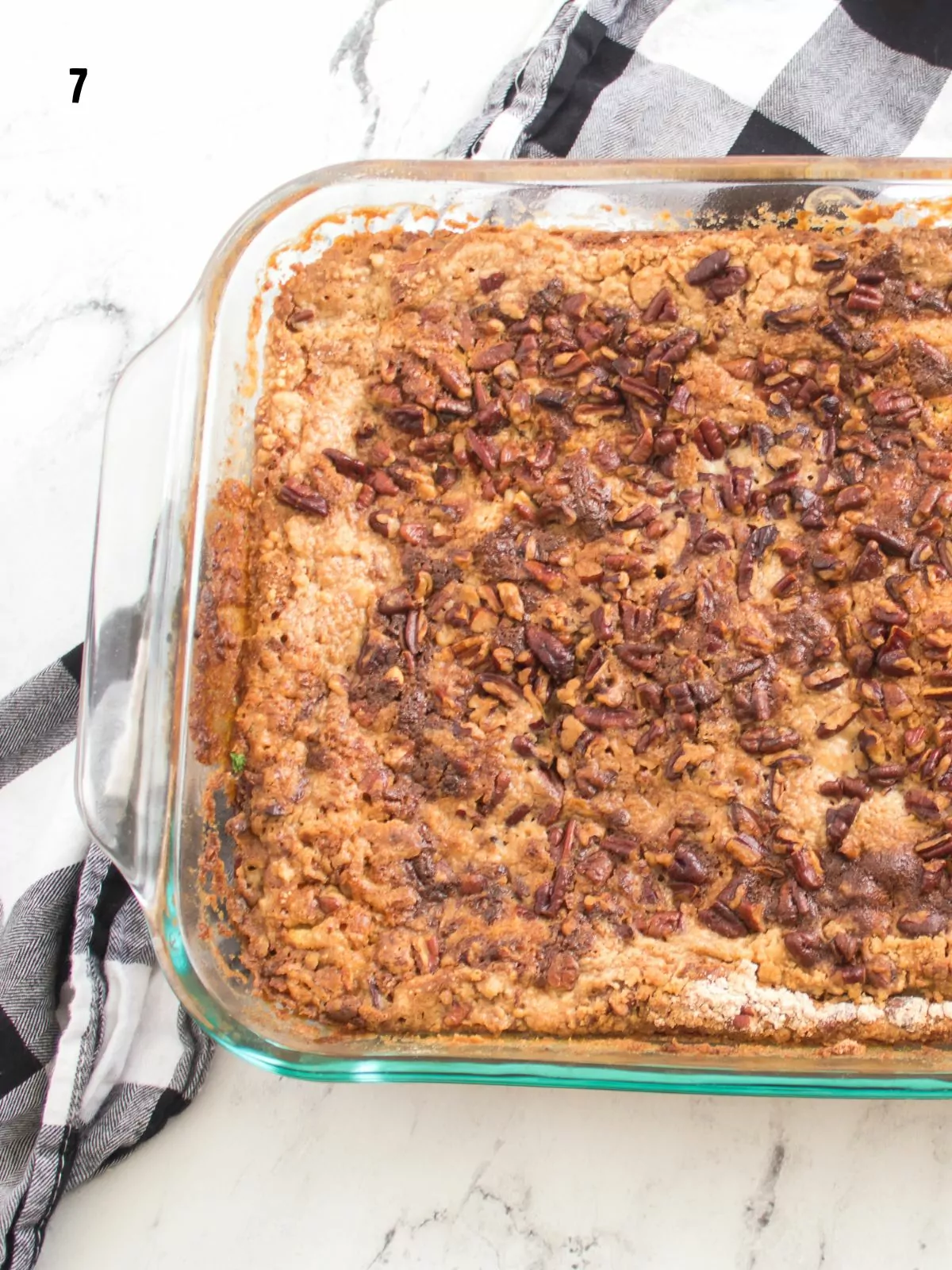 baked pumpkin dump cake in glass baking dish.