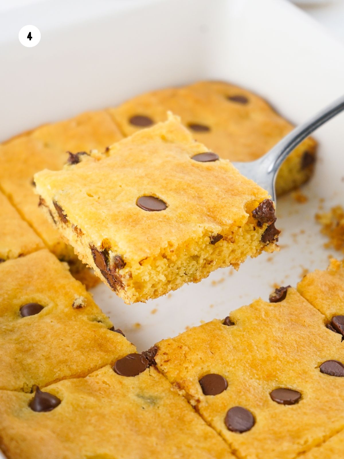 chocolate chip cookie bars using cake mix being served with spatula.