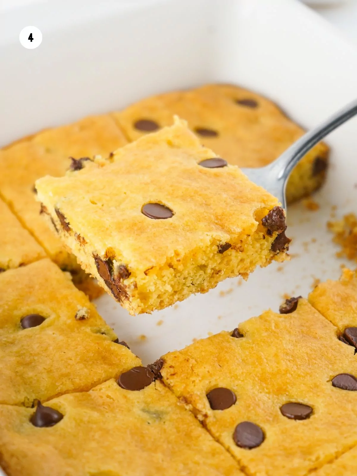 chocolate chip cookie bars using cake mix being served with spatula.