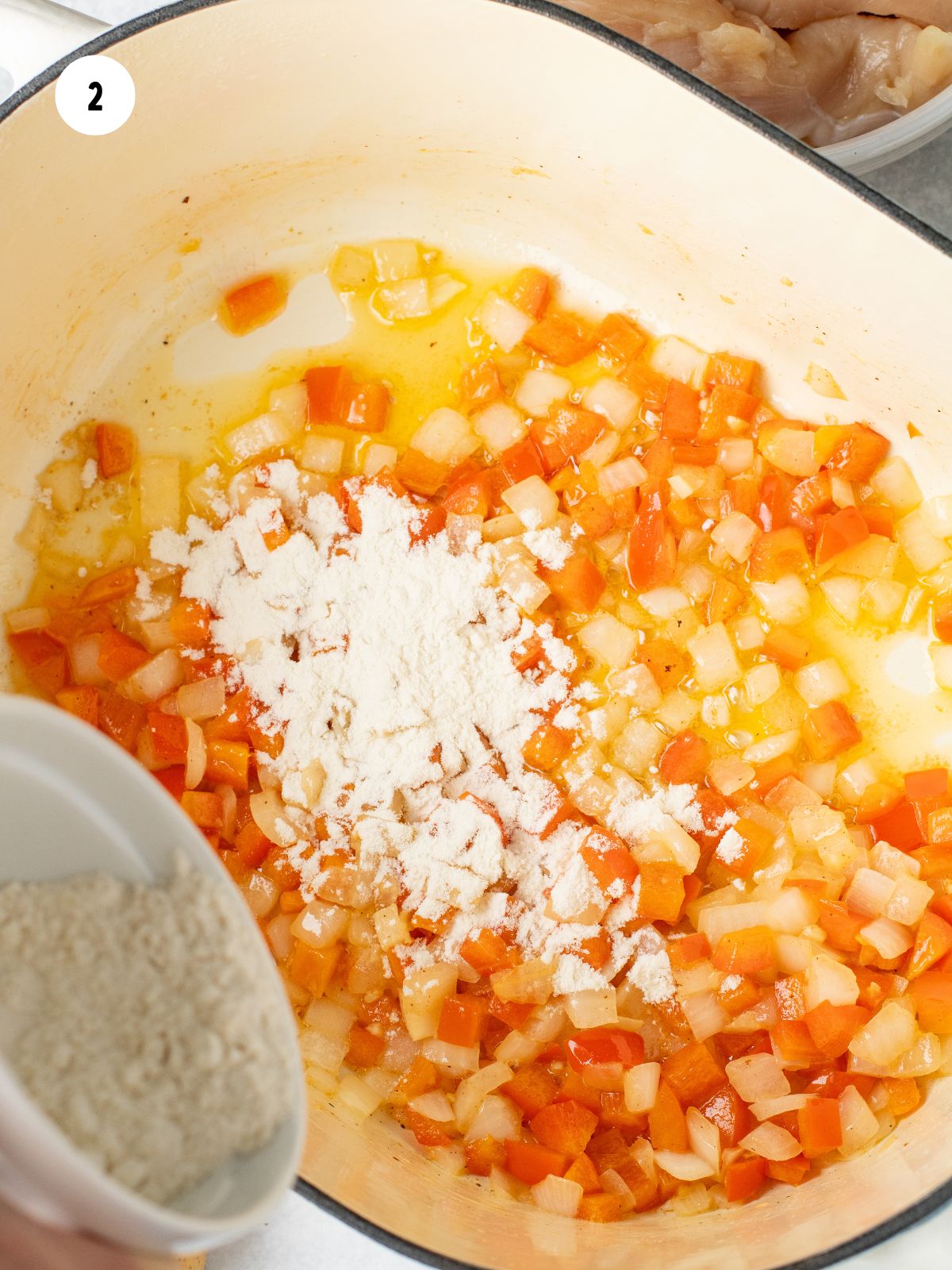 Flour added to the peppers and onions.