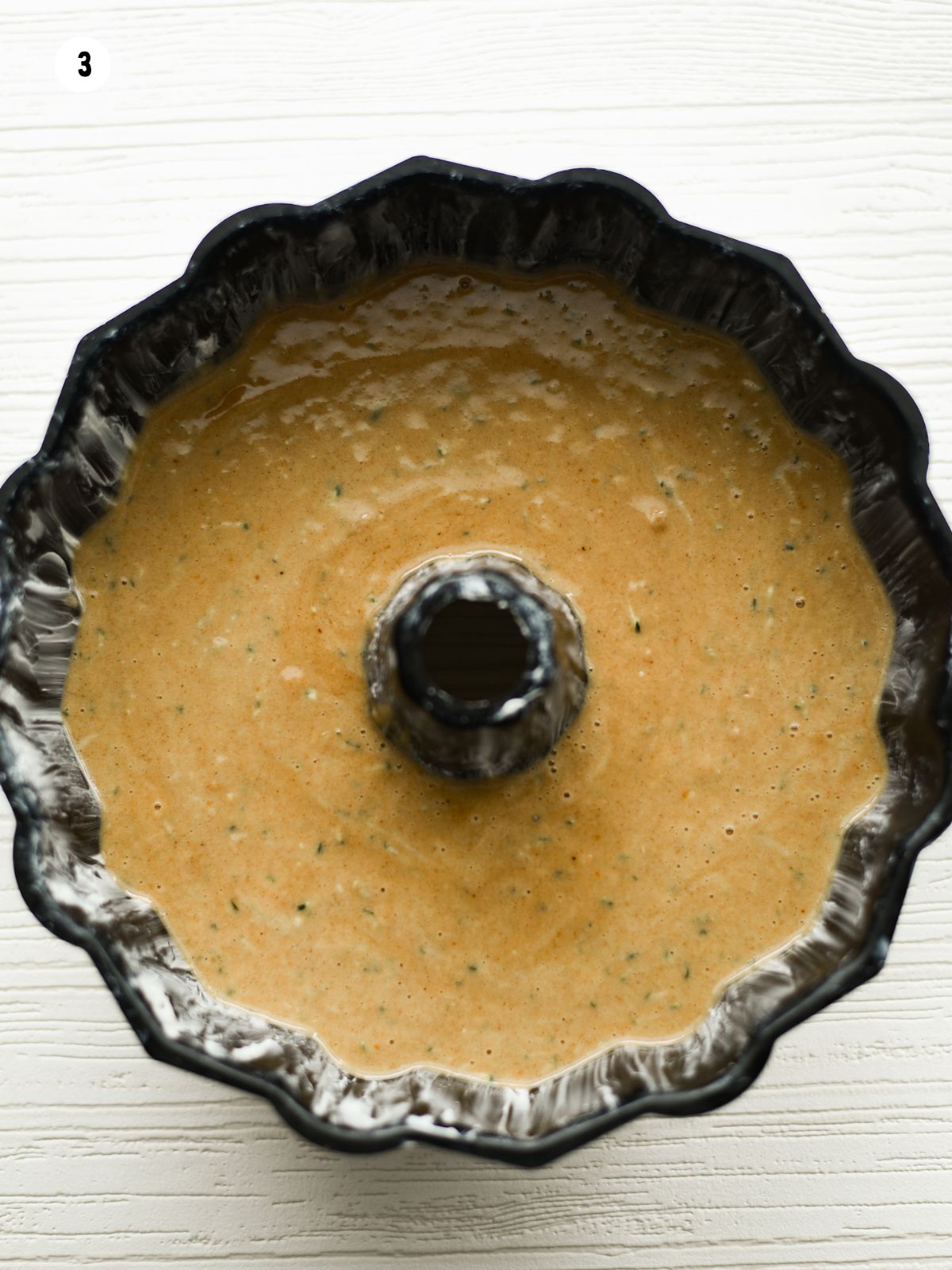 cake batter in bundt pan.