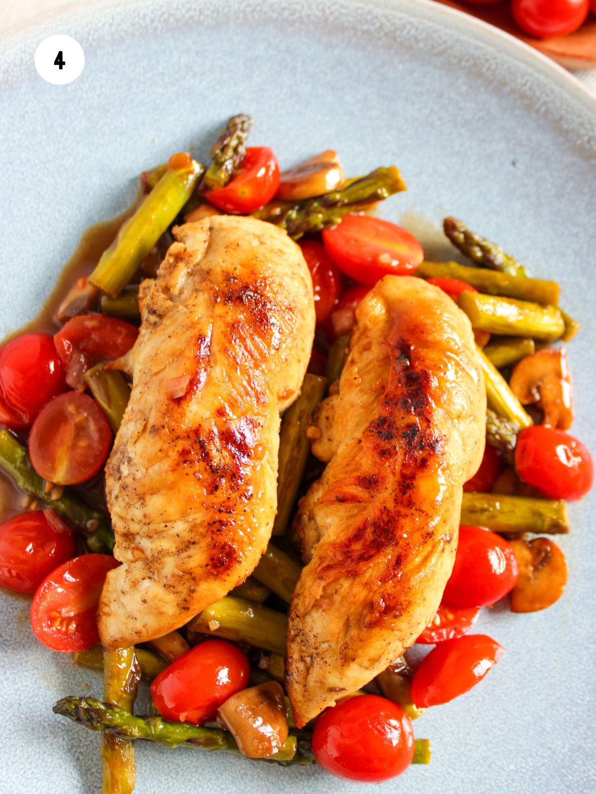 Chicken and veggies tossed in sauce.