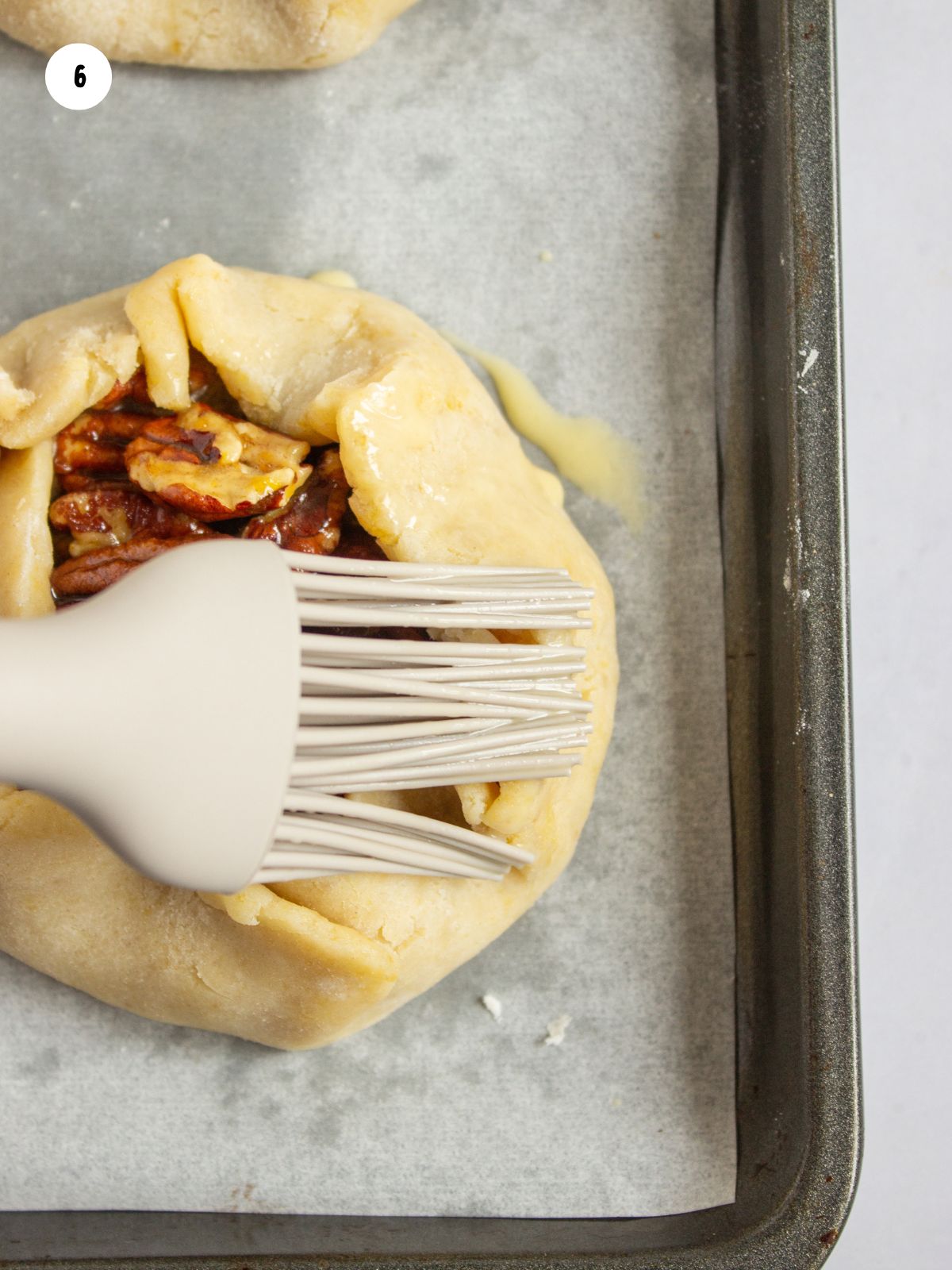 Brush with egg wash before baking.