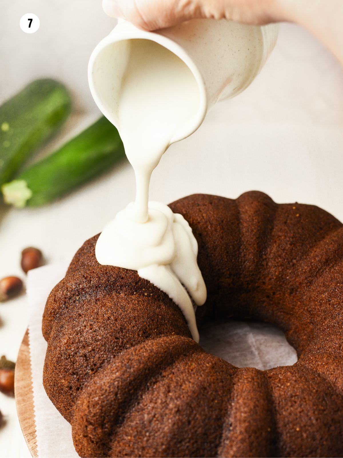 drizzle cream cheese frosting on top of bundt cake.