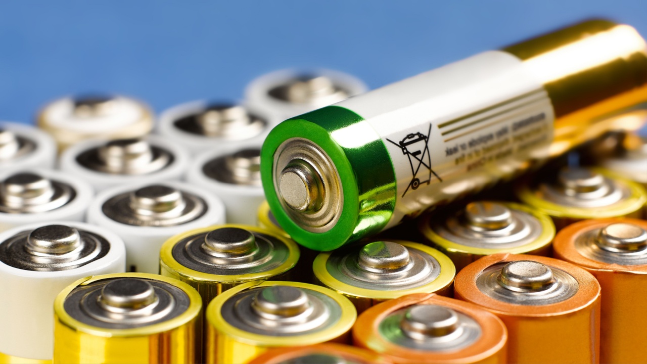 A closeup of a lot of AA batteries