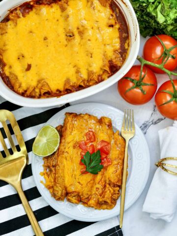Baked Chicken Taquitos in a casserole dish and served on a plate.