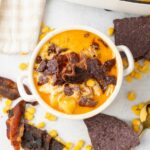 Chicken Corn Chowder topped with bacon and tortilla chips.