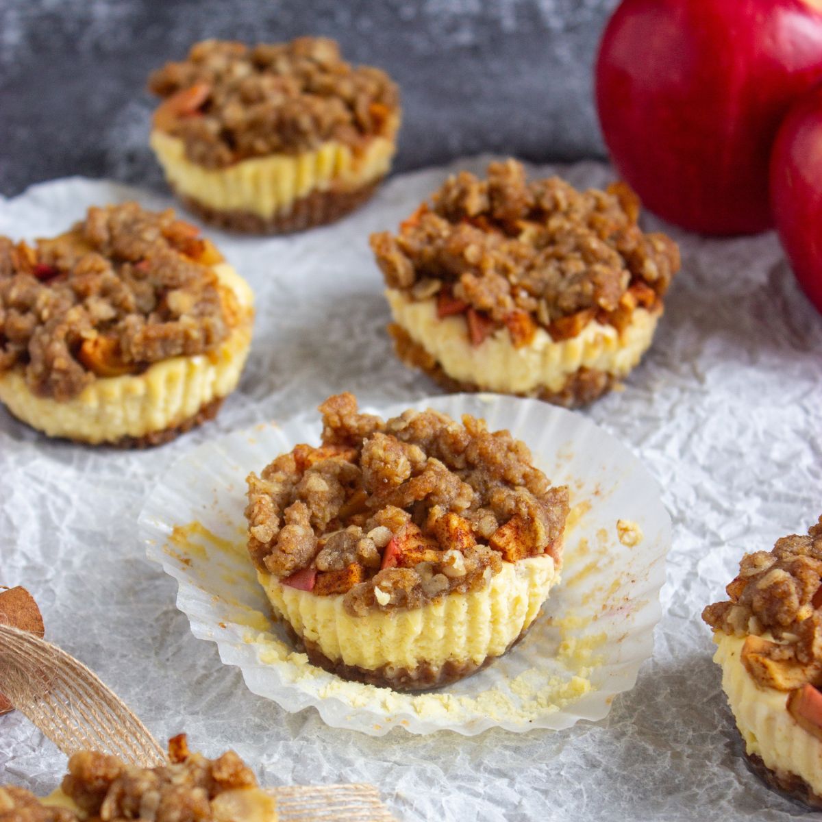 mini cheesecakes with apple and crumb topping.