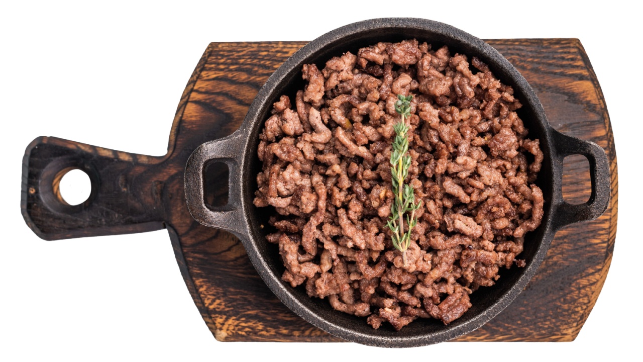 Fried ground beef and pork meat, fresh cooked mince in a skillet isolated on white background.
