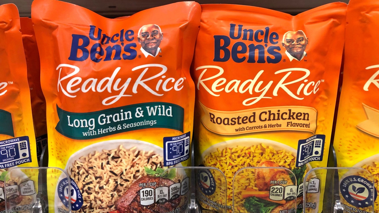 Grocery store shelf with bags of Uncle Ben's Rice on store shelf. Uncle Ben's is a brand name for parboiled rice and other related food products