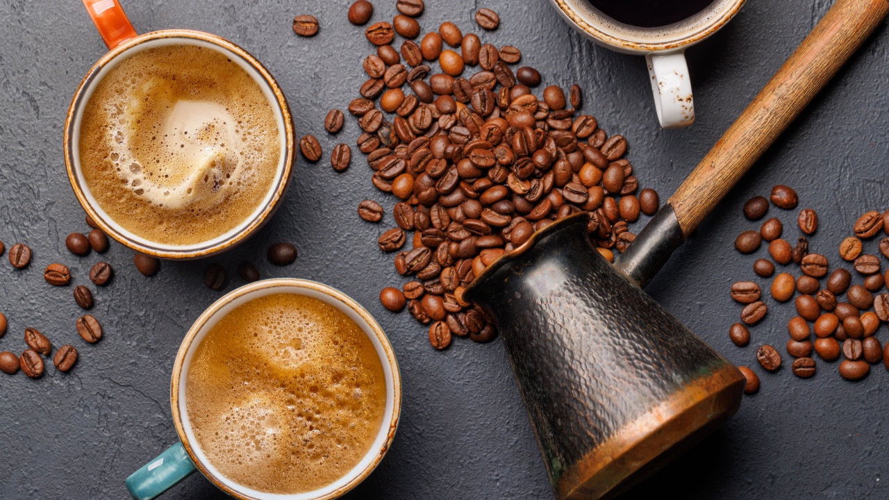 Roasted coffee beans and various espresso coffee cup. Flat lay