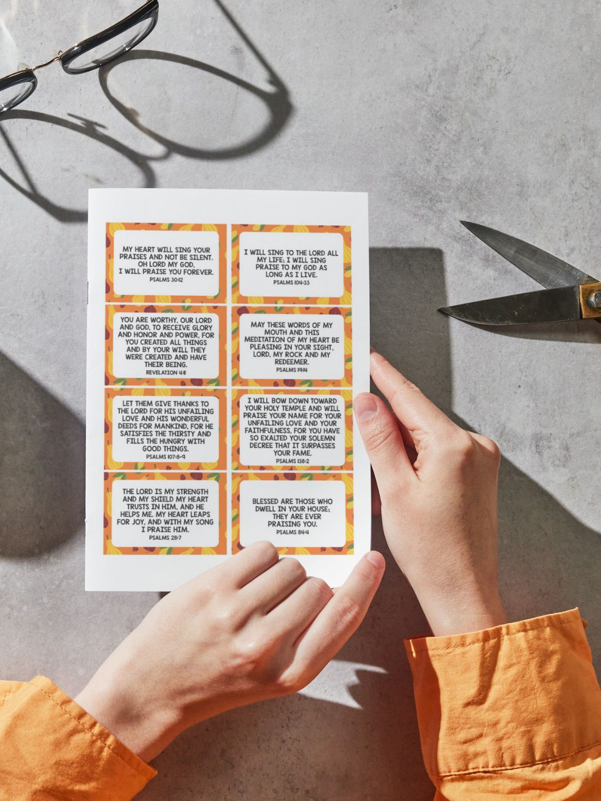scripture cards printed out and held with scissors nearby.