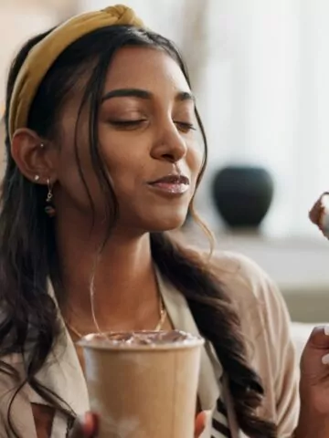 Woman, eating ice cream and living room on couch