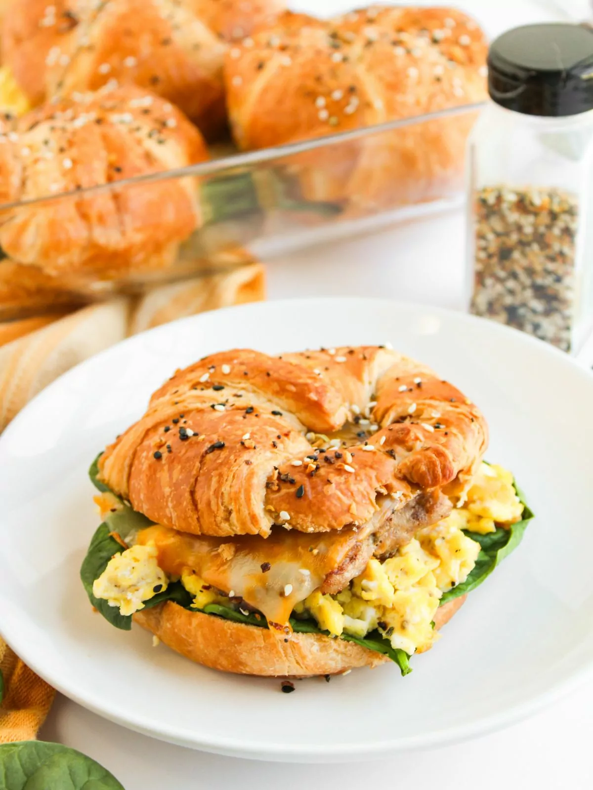 Croissant filled with fresh spinach, scrambled eggs, sausage patty, and melted cheese.