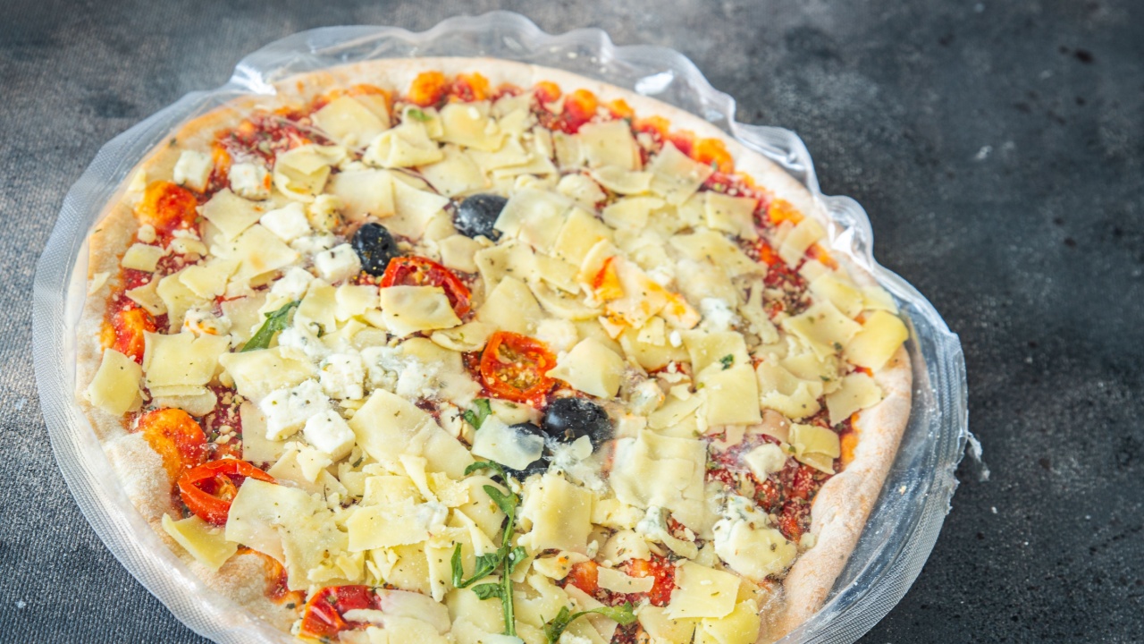 frozen pizza food packaging cling film cellophane quick defrost fresh healthy meal food snack diet on the table copy space food background rustic top view