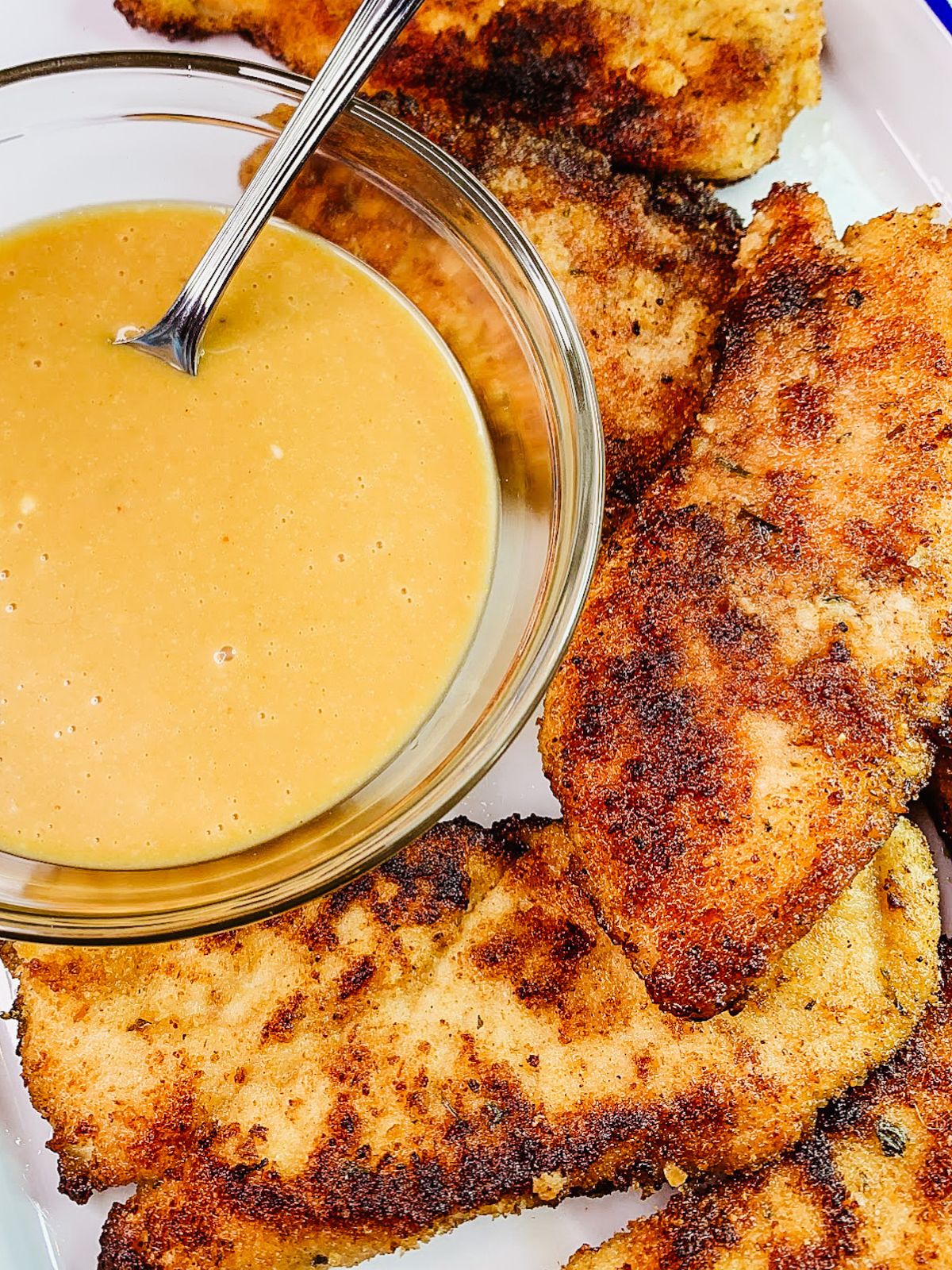 closeup of sauce for breaded chicken cutlets.