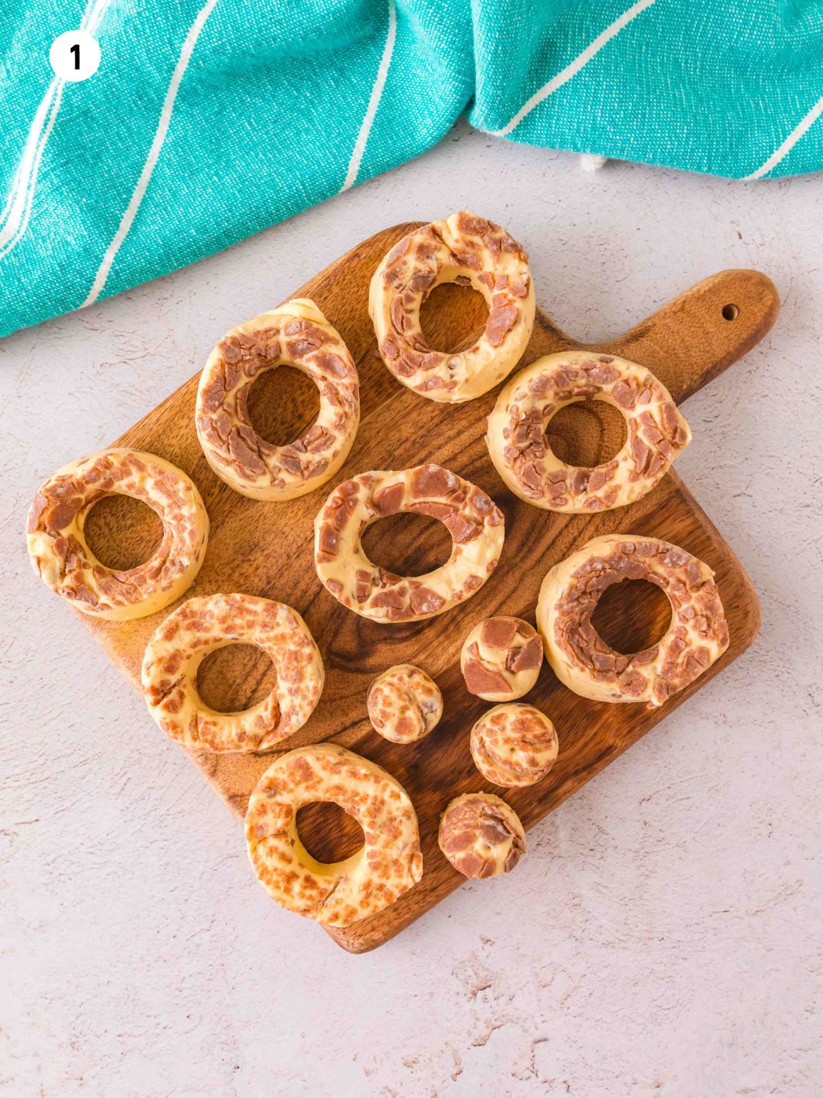 cut out donut holes from cinnamon rolls.