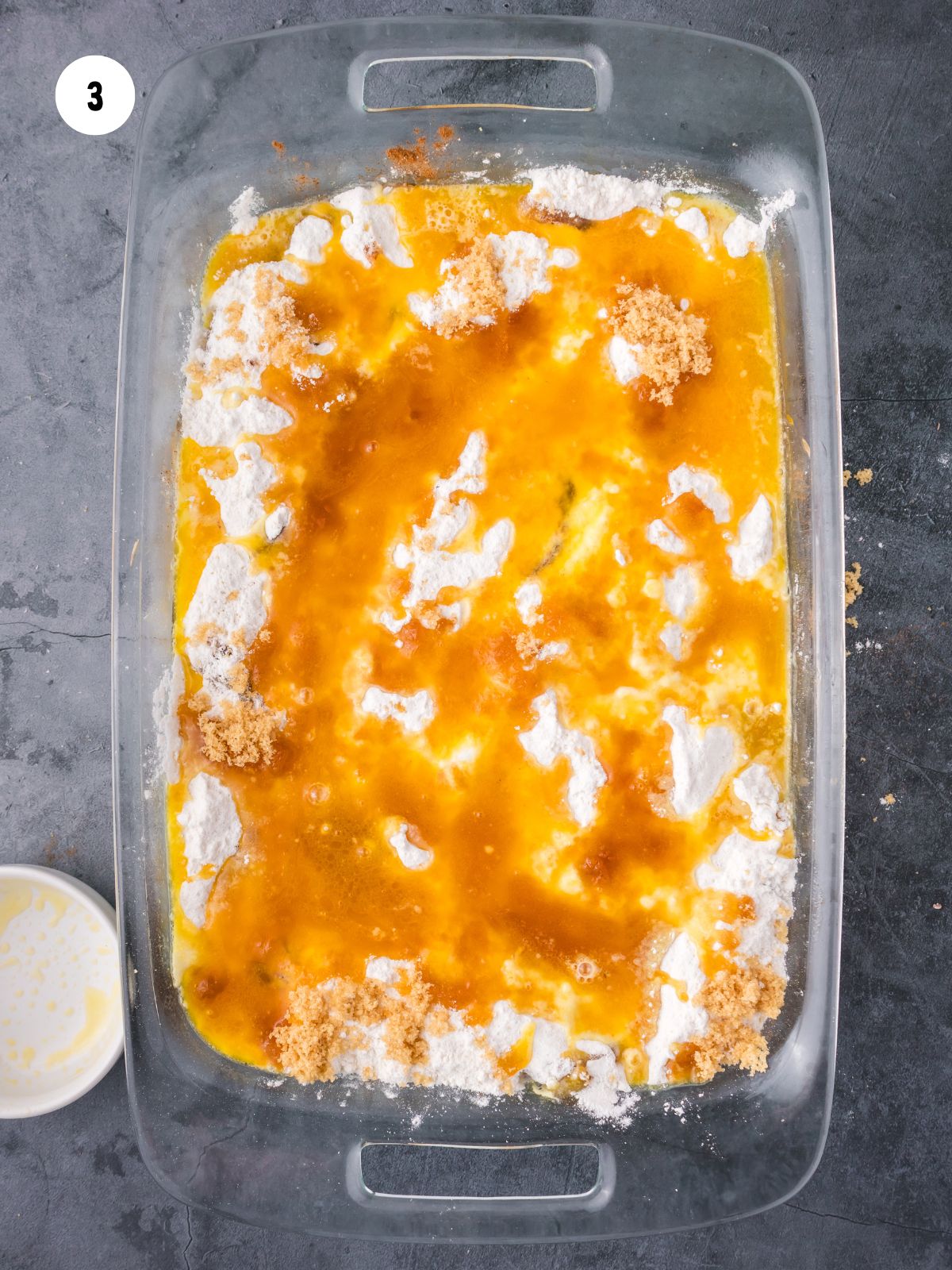 Melted butter added to the dish.