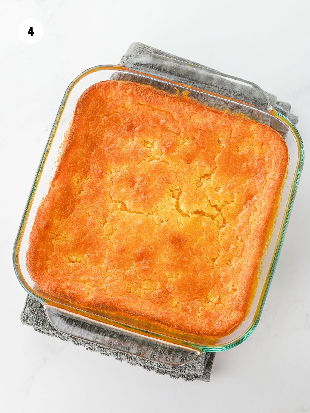 Baked casserole on a towel.
