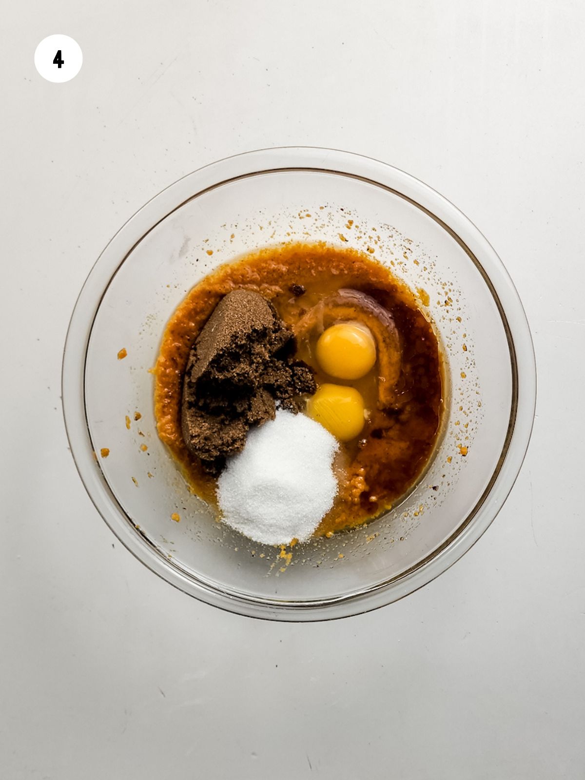 Eggs, both sugars, and vanilla extract added to the pumpkin and butter.