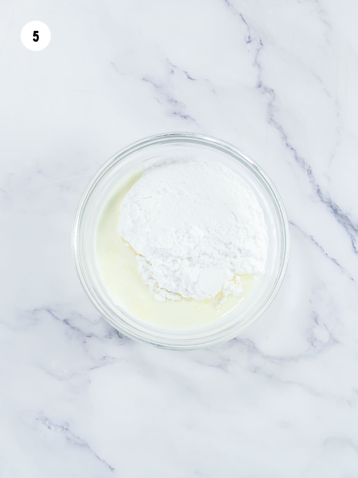 Bowl with powdered sugar and heavy cream to make glaze.