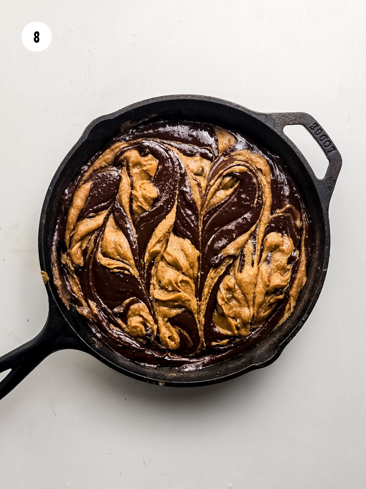 Brownie batter and cookie dough swirled together.