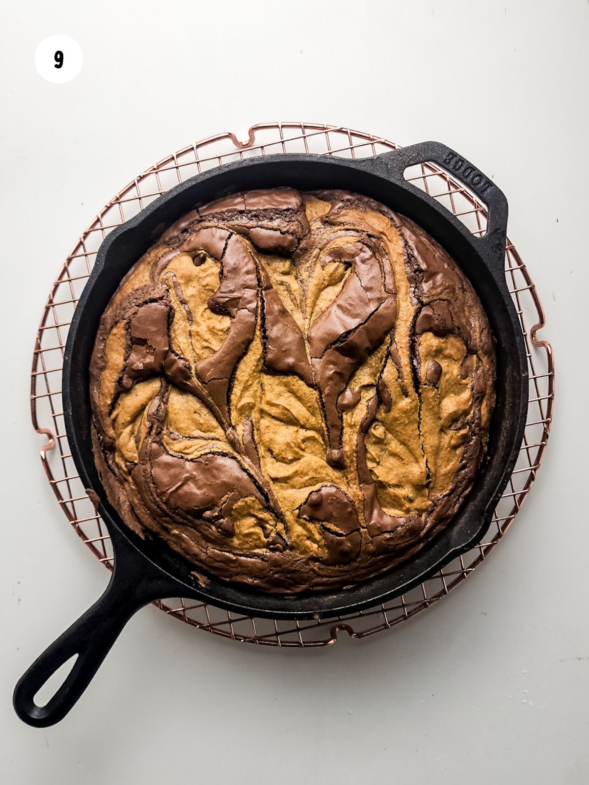 baked pumpkin brookie in a cast iron skillet.