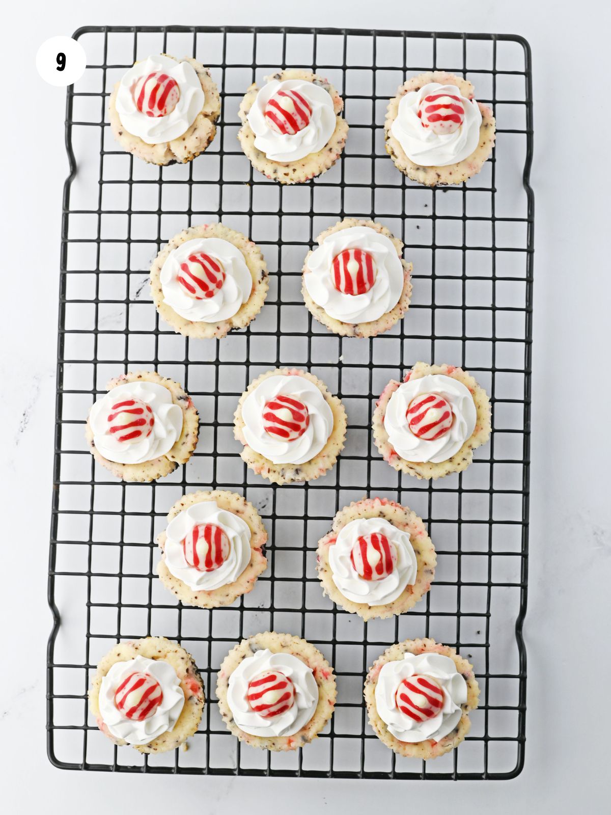 Mini cheesecakes topped with Peppermint Hershey Kisses.