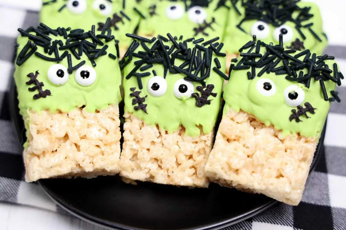 Rice krispie treats dipped in green candy melts and decorated like Frankenstein.