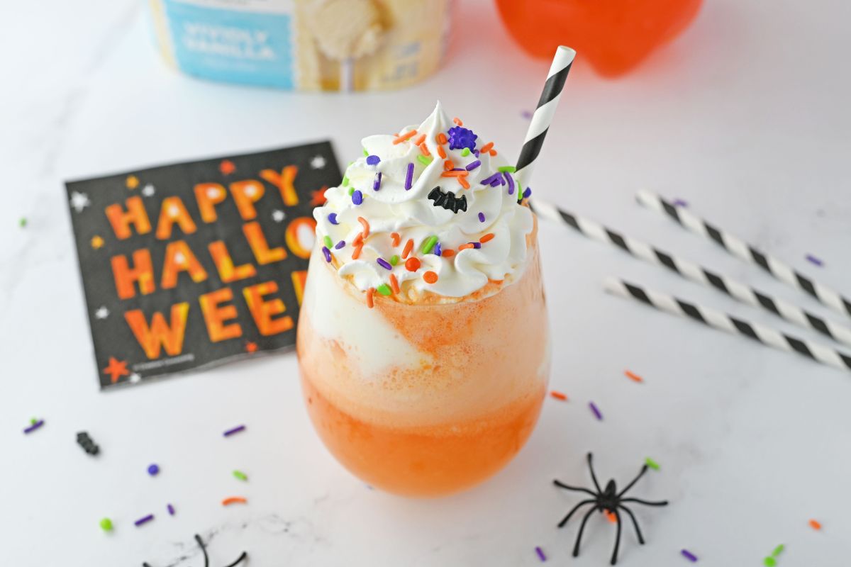 candy corn themed punch with halloween sprinkles.