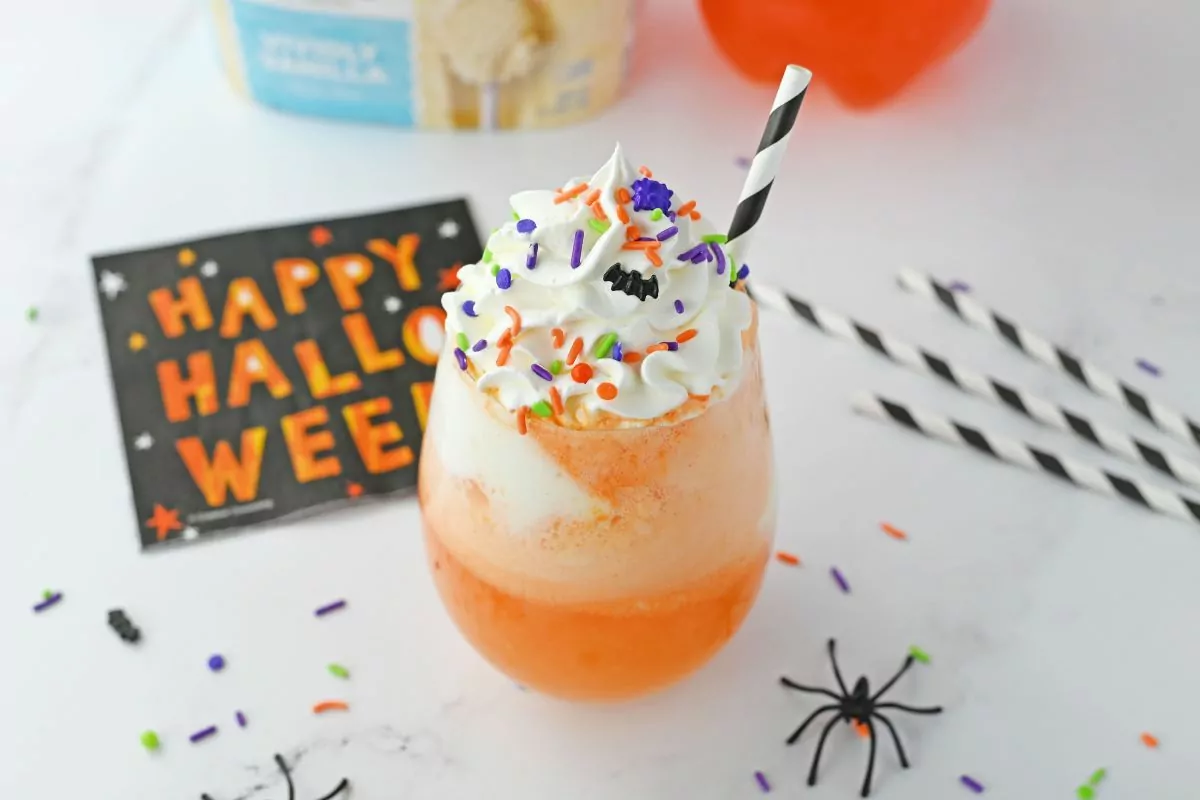 candy corn themed punch with halloween sprinkles.
