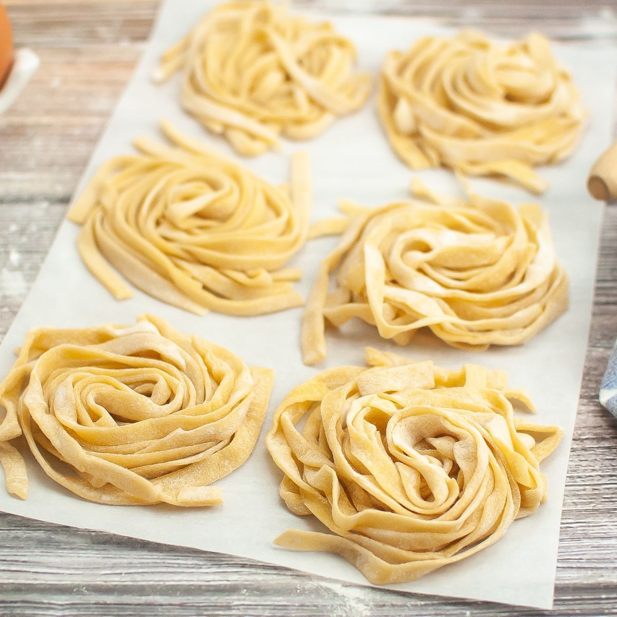 large photo of 6 mounds of homemade pasta.