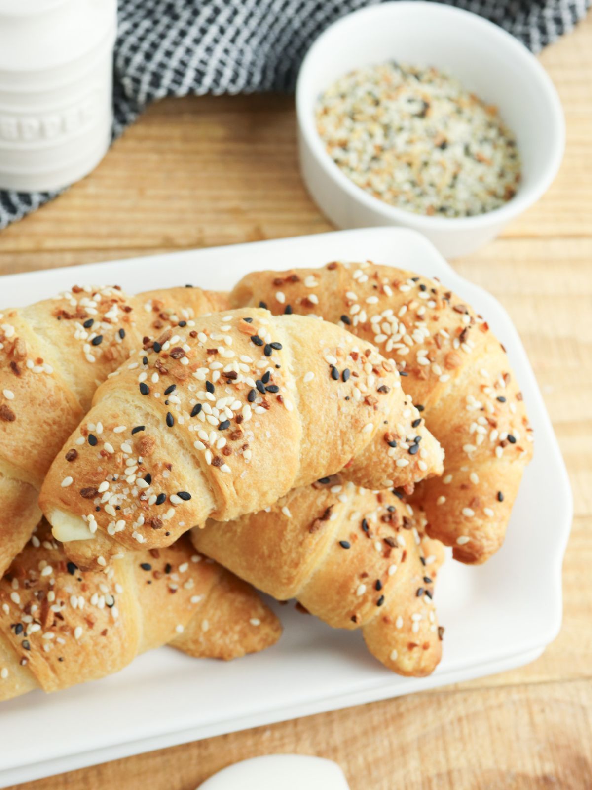 Crescent rolls filled with cream cheese and everything seasoning on top.