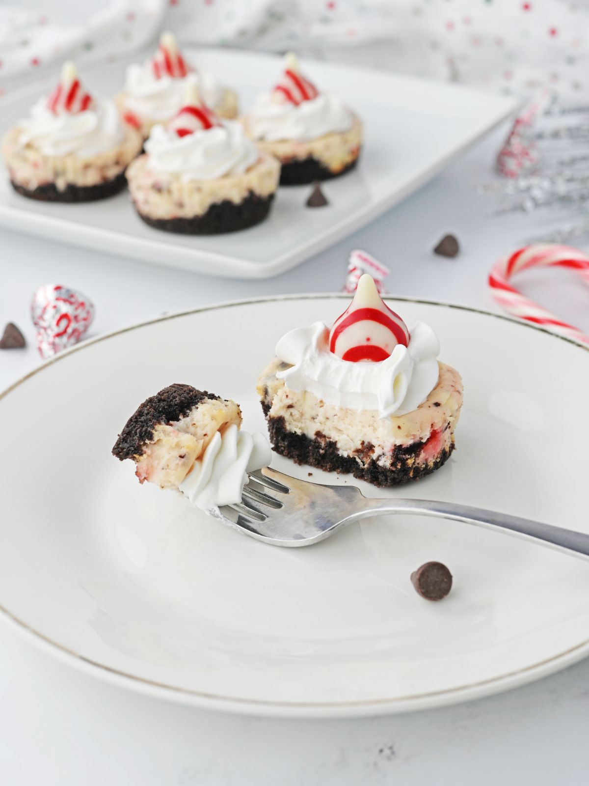 Mini oreo peppermint cheesecake with a bite on a fork.