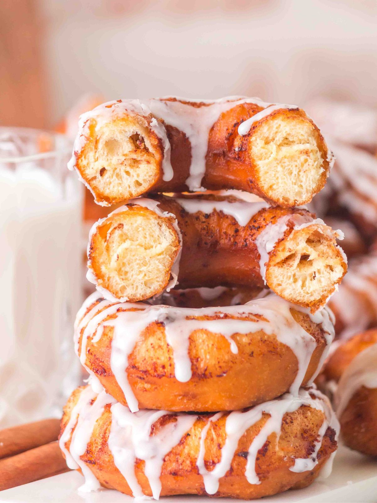 Third donut in a stack has been cut in half to show the inside.