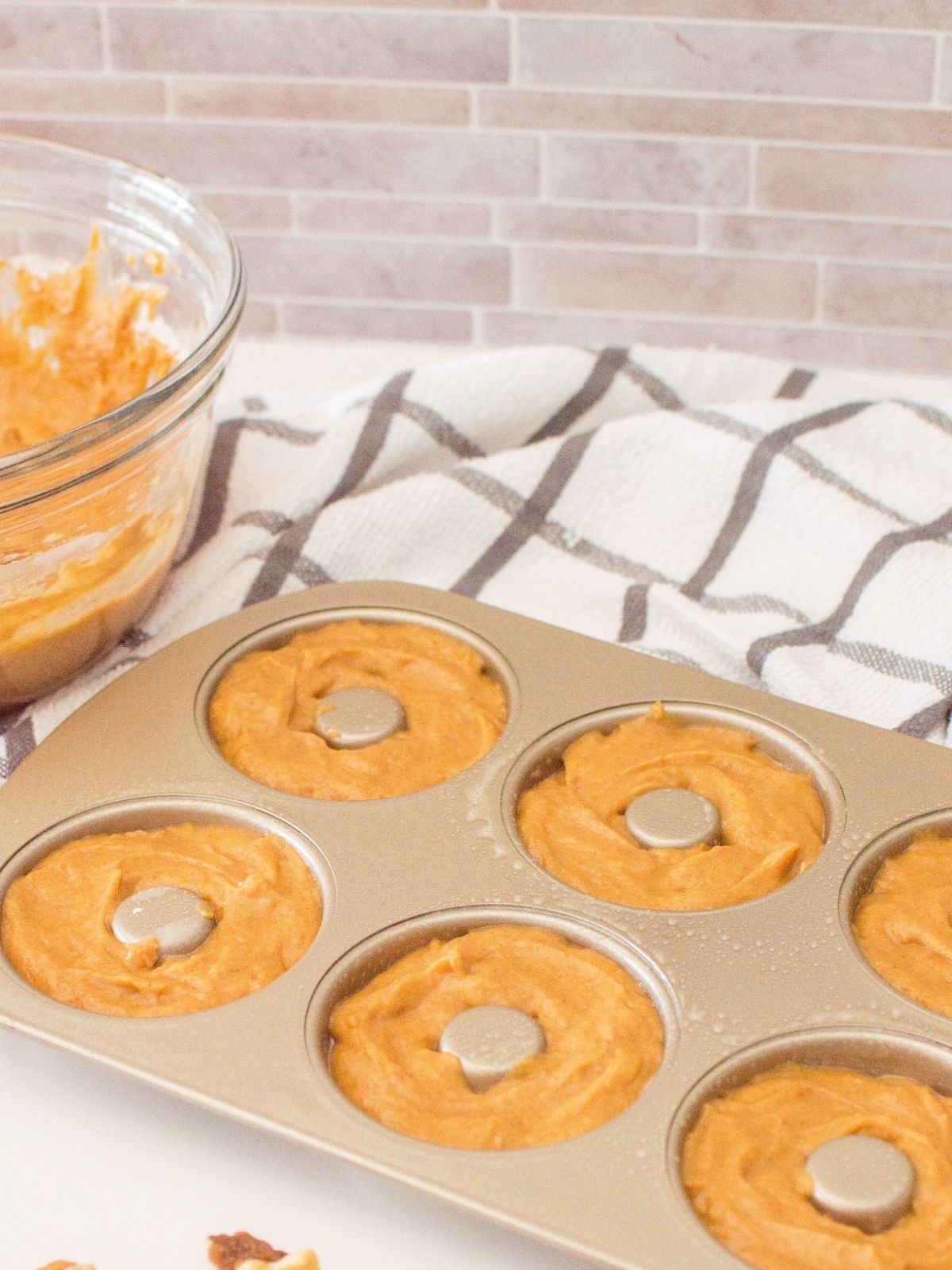 pumpkin batter in donut pan.