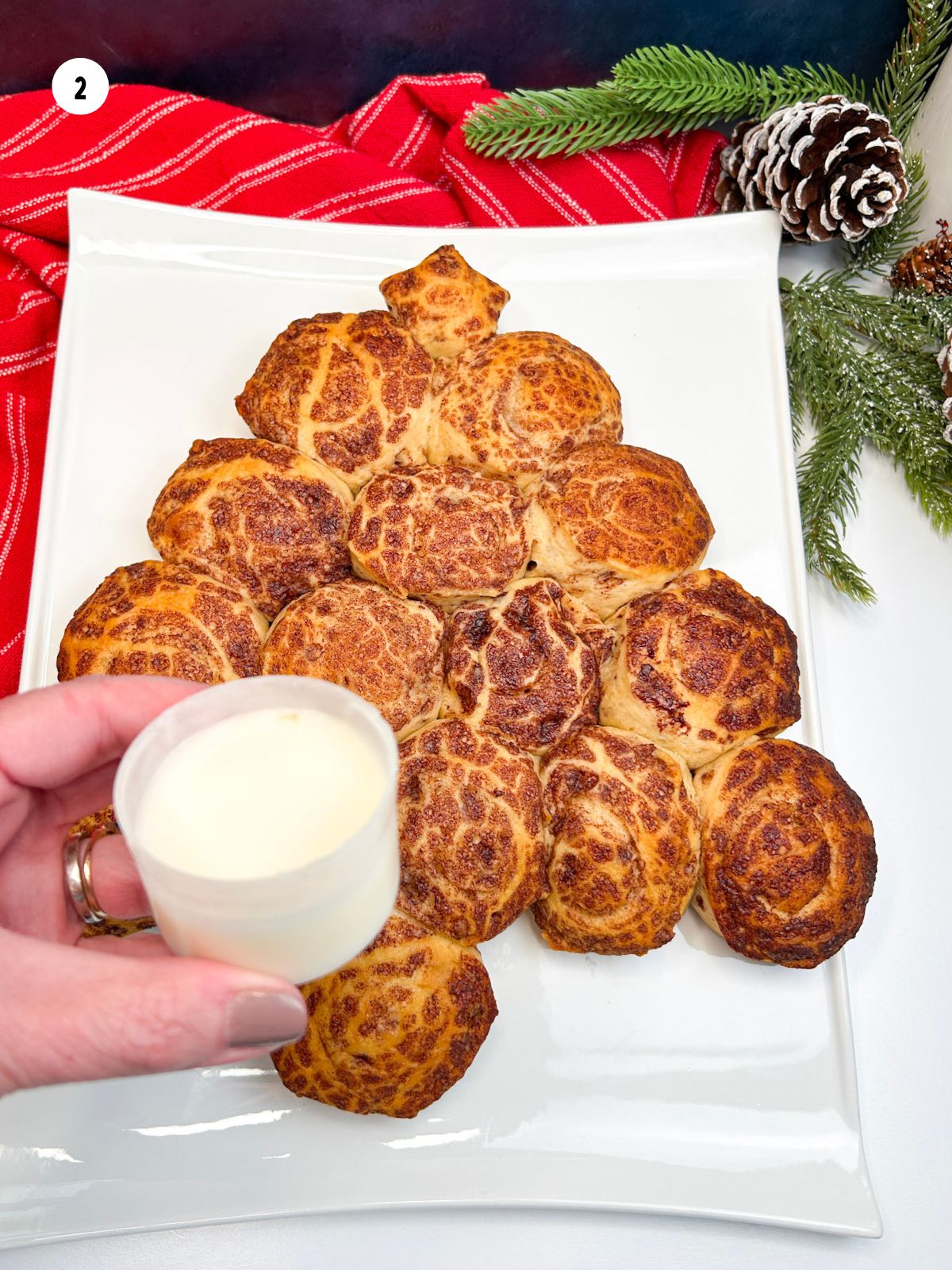 Icing for baked cinnamon rolls.