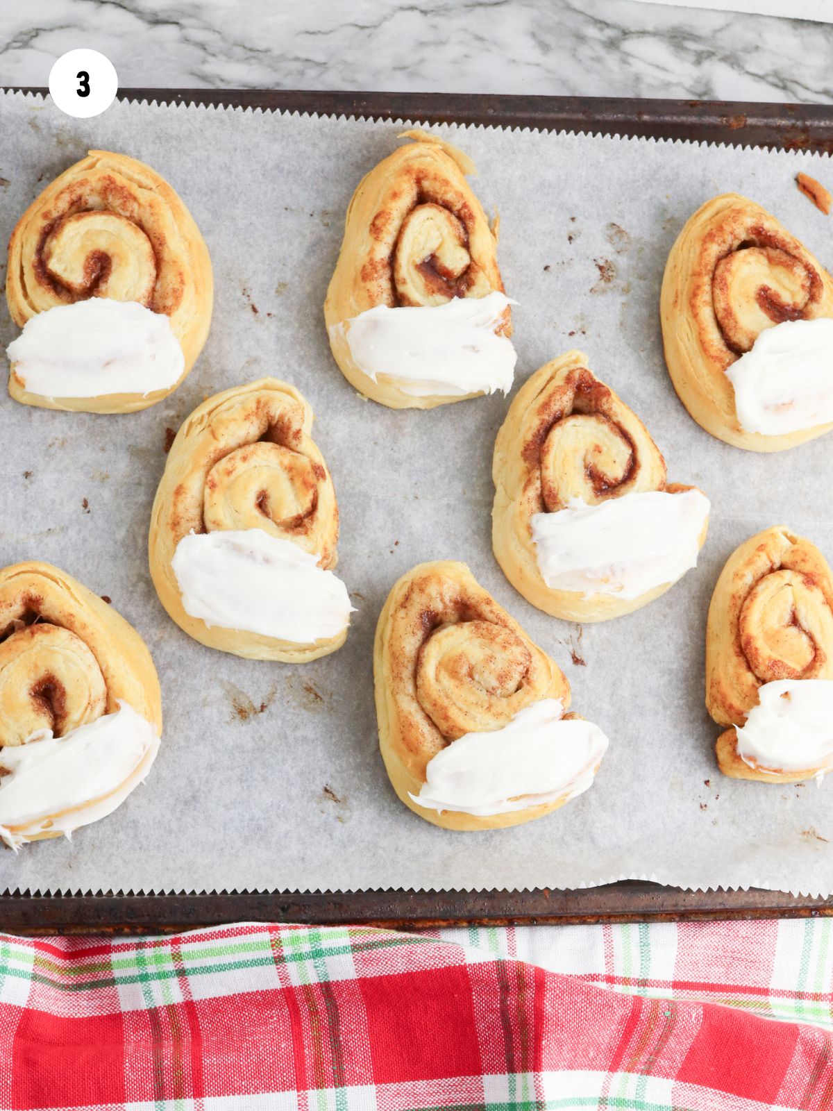 White frosting added to the wide end of the triangle.