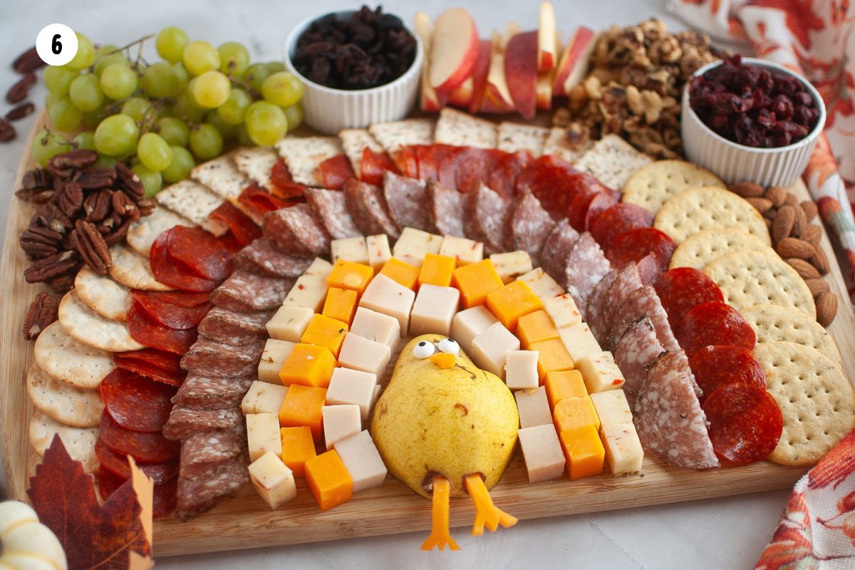 Add piles of fresh apples and grapes, dried fruit and nuts.