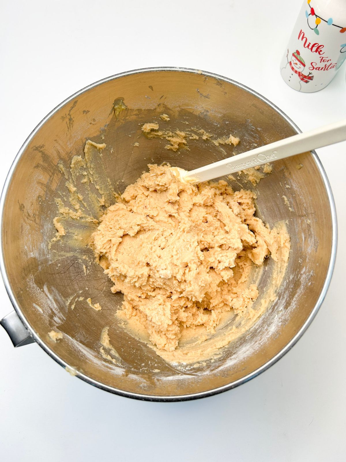 one basic cookie mixed in bowl with rubber spatula.