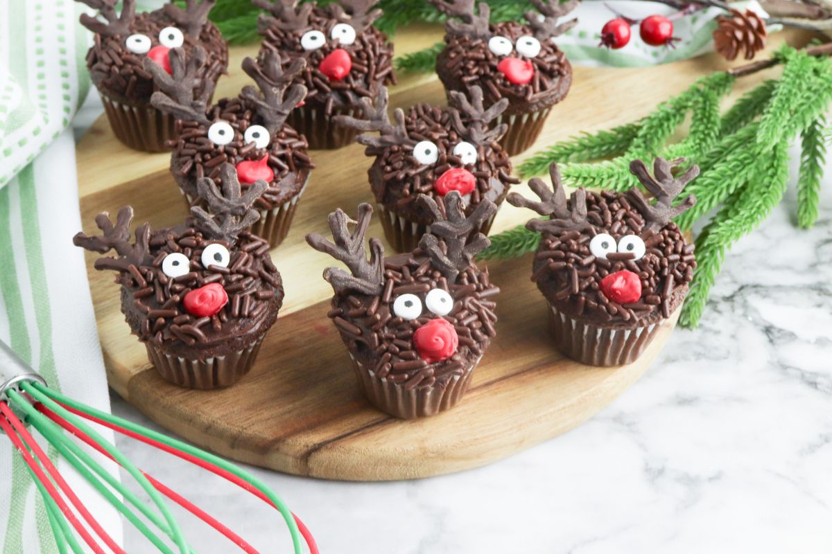 Mini Reindeer Cupcakes decorated with chocolate sprinkles and candy eyes.