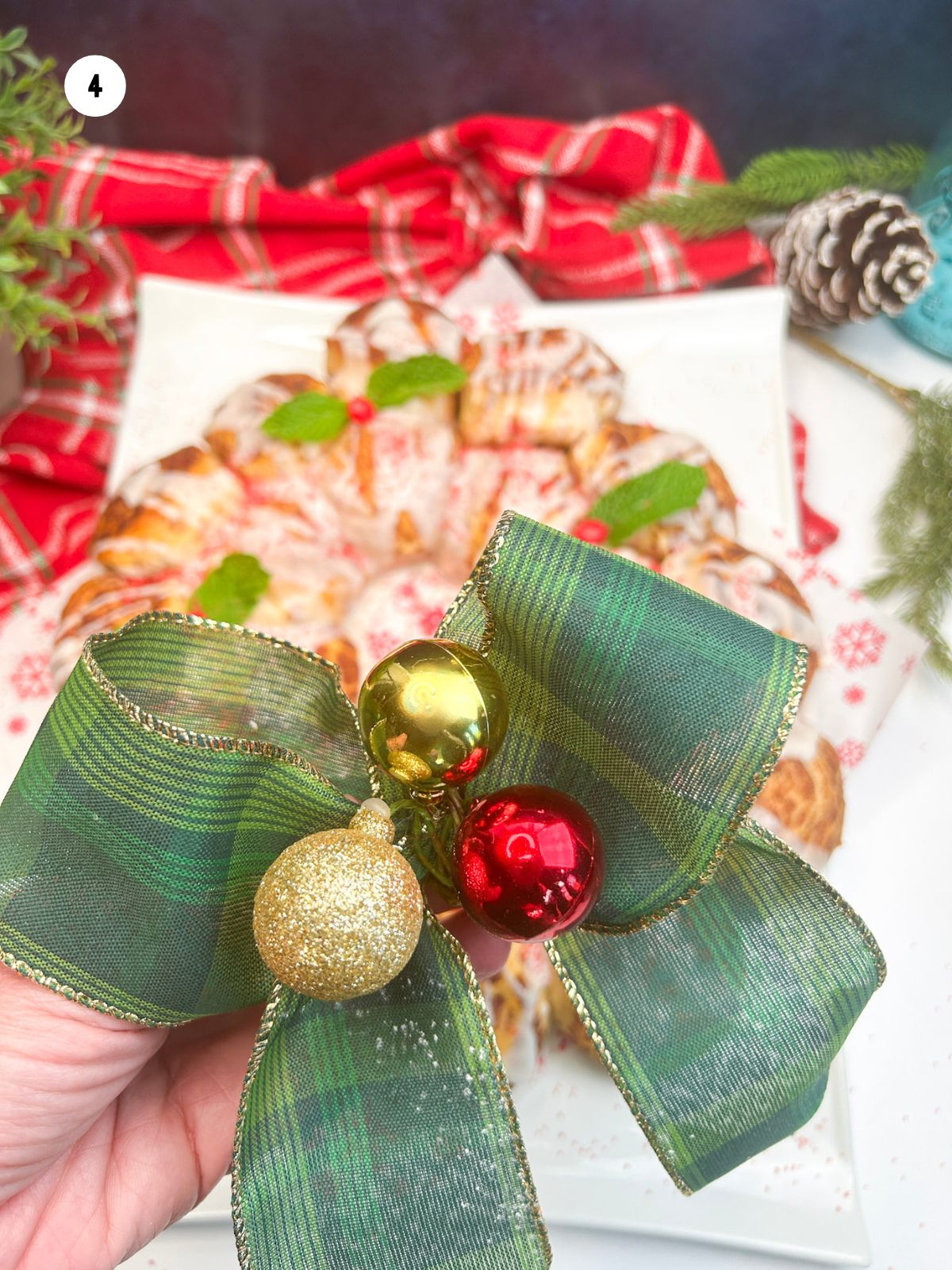 decorate the cinnamon roll wreath with a festive bow.