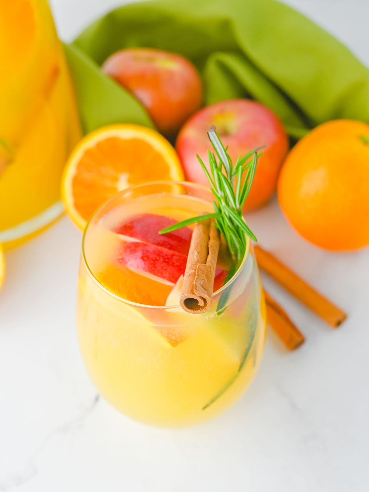 closeup of glass of non-alcoholic beverage made with orange juice and lemonade.