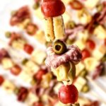 Antipasto Skewer filled with cheese, tortellini, tomatoes, olives, and salami