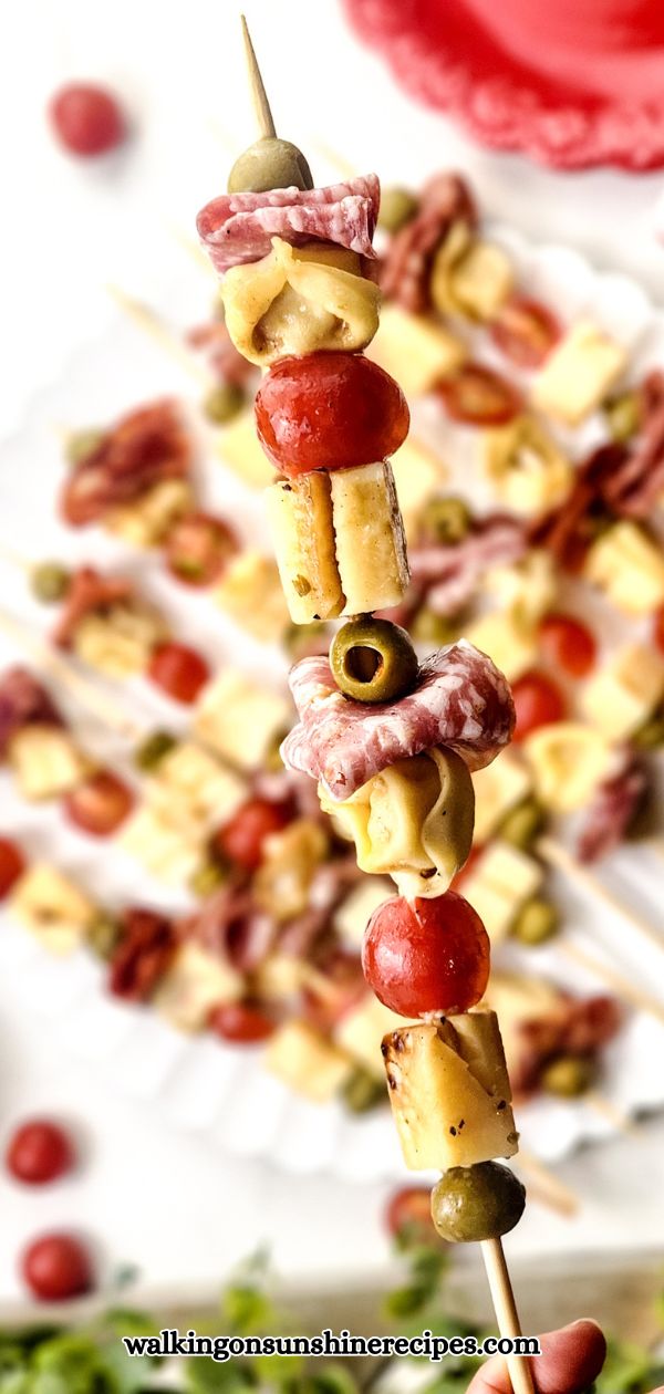 Antipasto Skewer filled with cheese, tortellini, tomatoes, olives, and salami